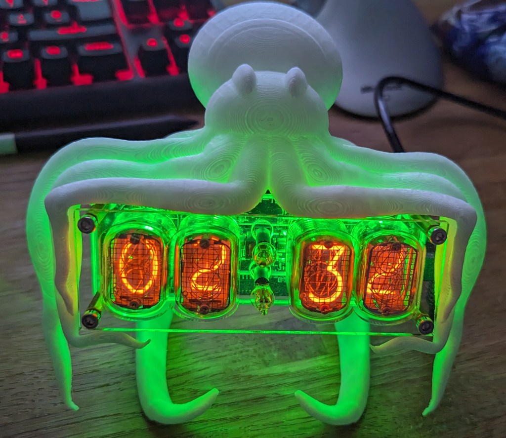 3D printed octopus holding a Nixie clock