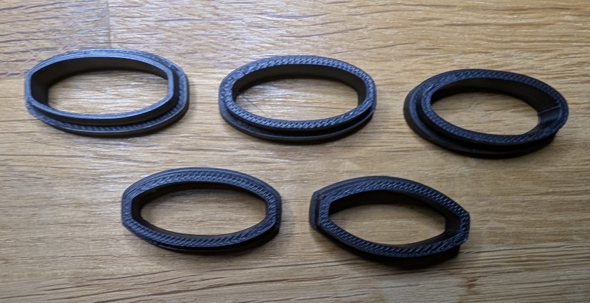 Top-down view of prototype seatpost inserts V1 to V5 arranged in order