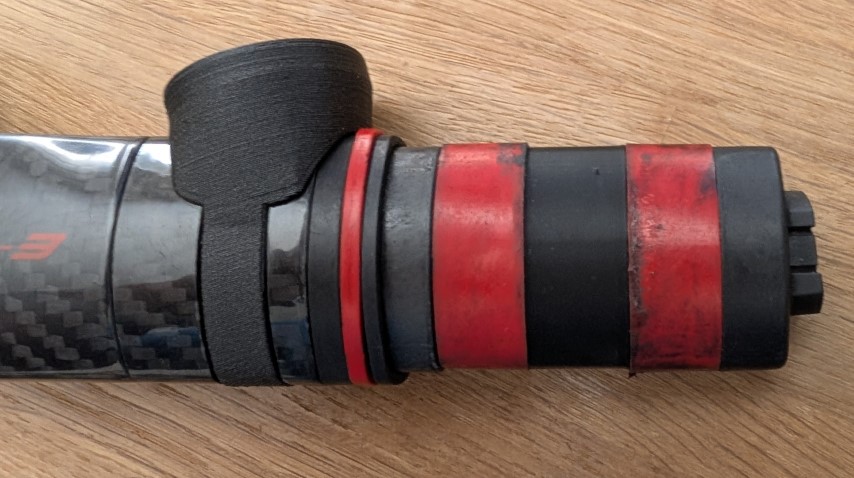 Full assembly of 3D printed insert, elastomer, bolt, and saddle clamp prior to installation