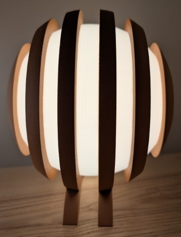 Front view of the Originless Glow lamp showing even radial spacing and soft, diffused lighting.