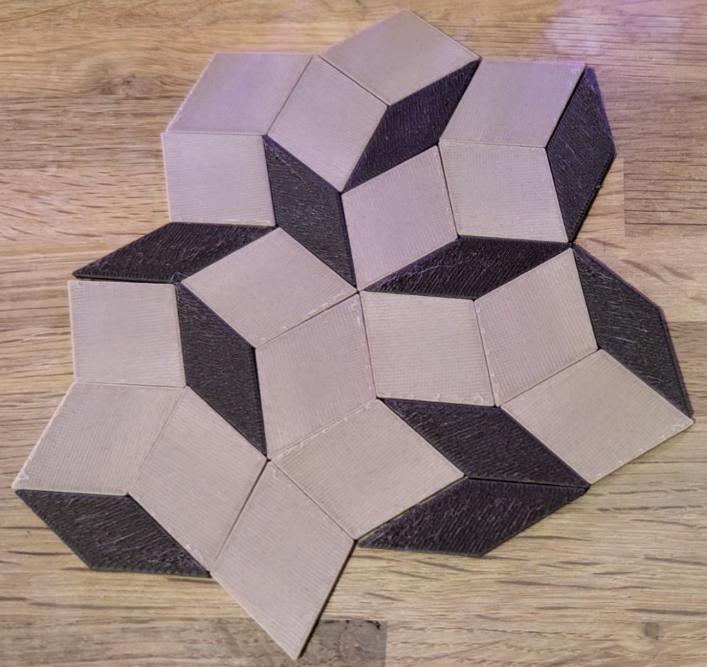 Close-up of 3D-printed Penrose P3 tiles arranged in a sharp, geometric pattern that looks like a 3D optical illusion. Striking, but maybe a bit too pointy for a fridge door.