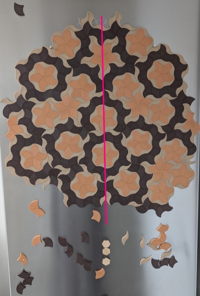 The same magnets after being realigned so the pink line is vertical, creating a balanced, satisfying, and much prettier layout.