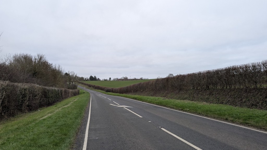 Image of an open, dry, countryside road during winter.