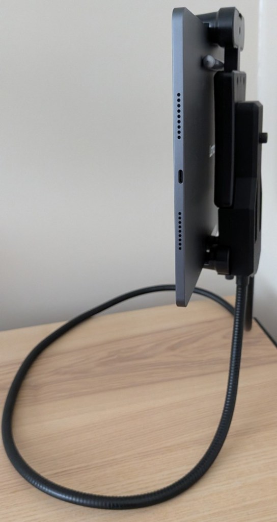 A clean side profile view of the version 2 setup. The tablet is held vertically by a streamlined, integrated 3D-printed backing plate that connects directly to the dual metal tips of the black gooseneck arm.